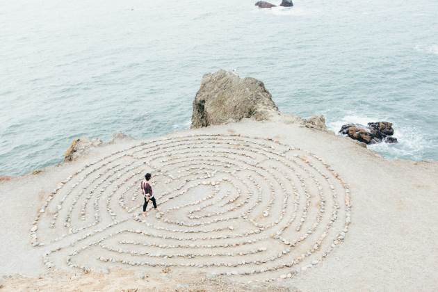 A woman walking through a labyrinth
