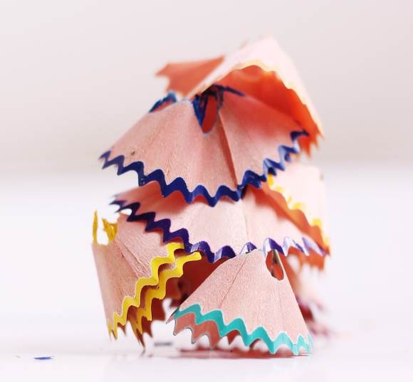 A stack of colored pencil shavings