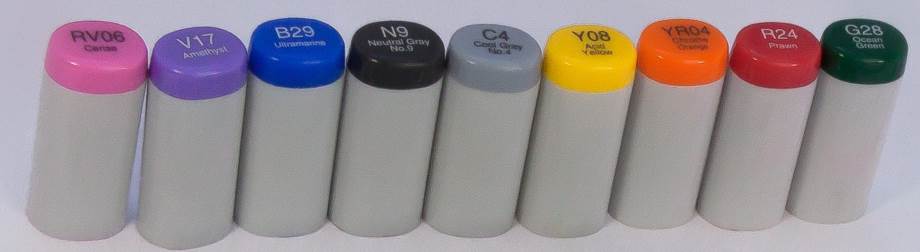 Various Copic Sketch marker caps arranged to show the variety of colors available.